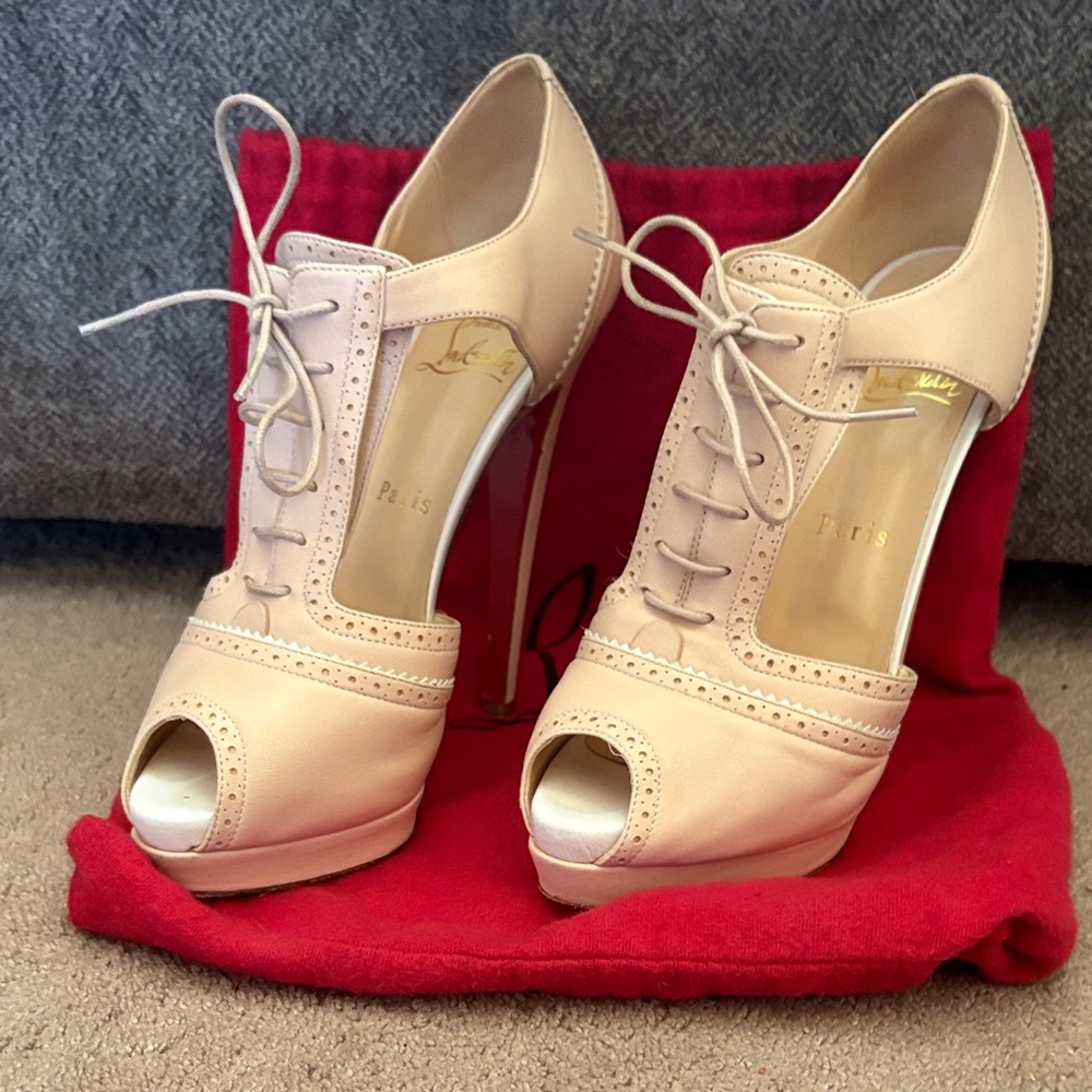 Christian Louboutin Nude Peep-Toe Lace-Up Heels. Meree leather cutout pumps.
